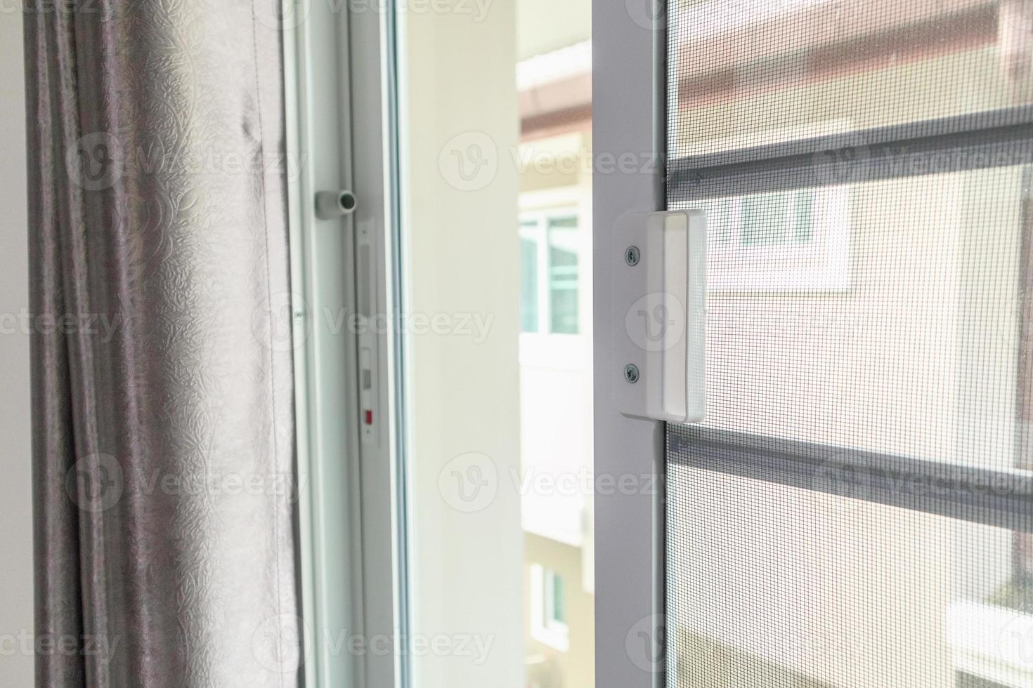 mosquito net wire screen on house window protection against insect photo