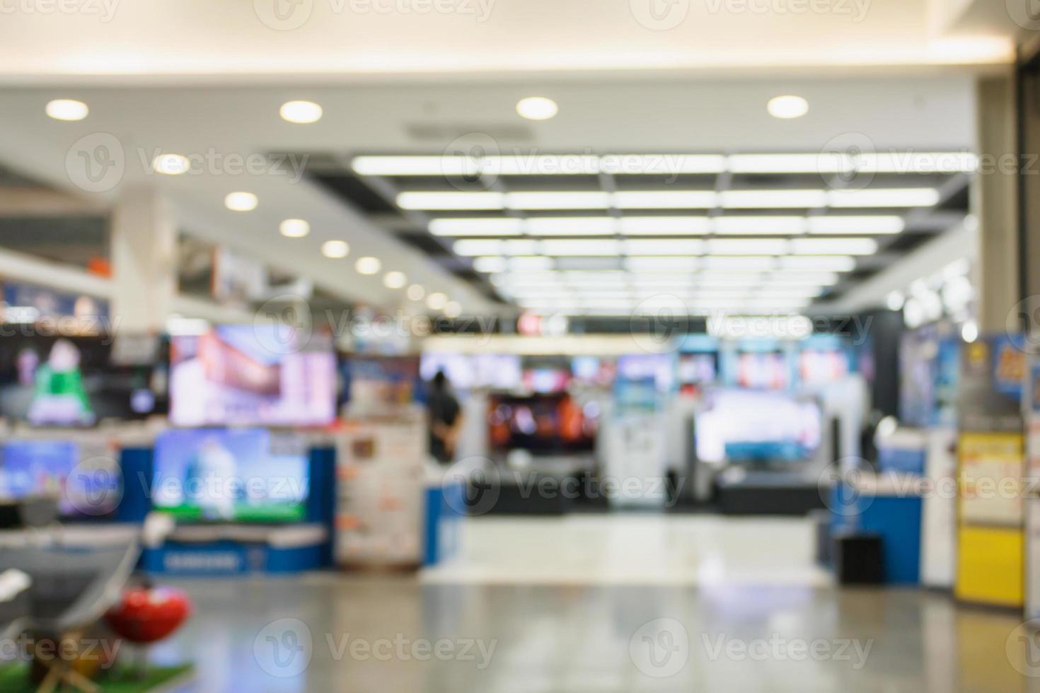 Television Smart TVs 4K Ultra HD display on shelves in eletronic department store blur background photo