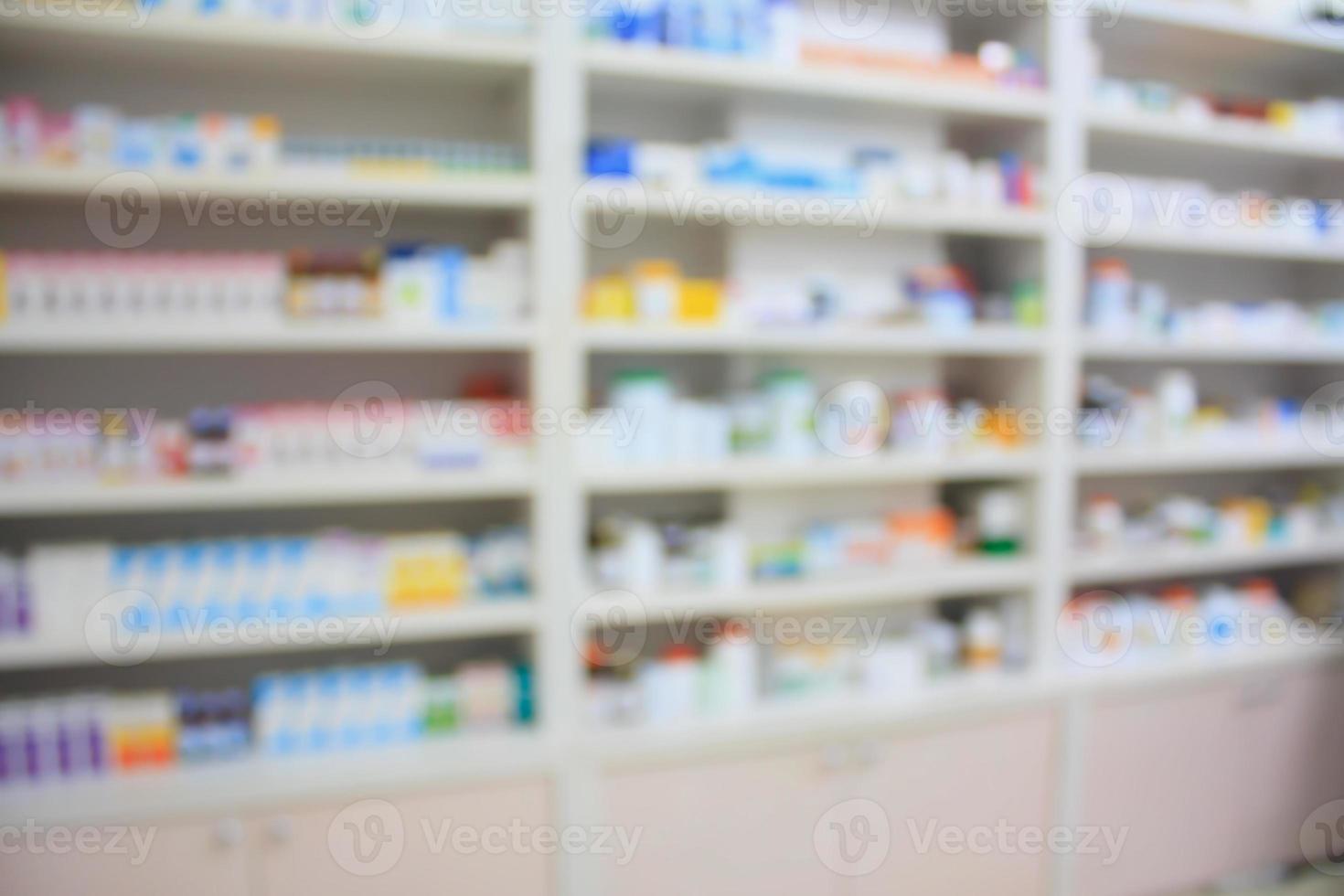 blur shelves of drugs in the pharmacy shop photo