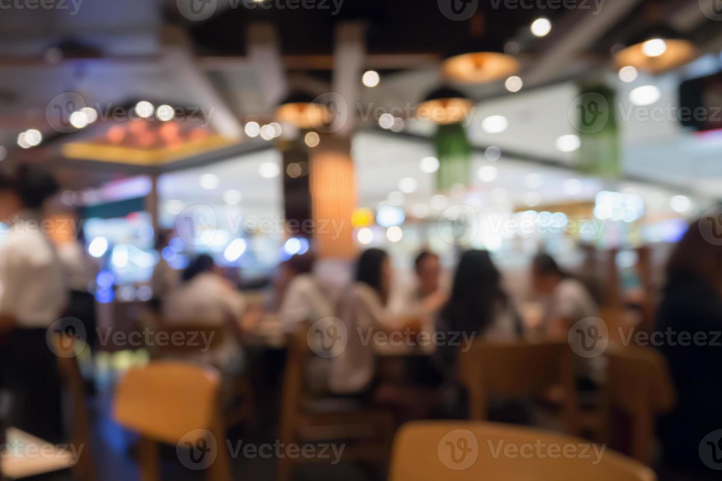 People in restaurant cafe interior with bokeh light blurred customer abstract background photo