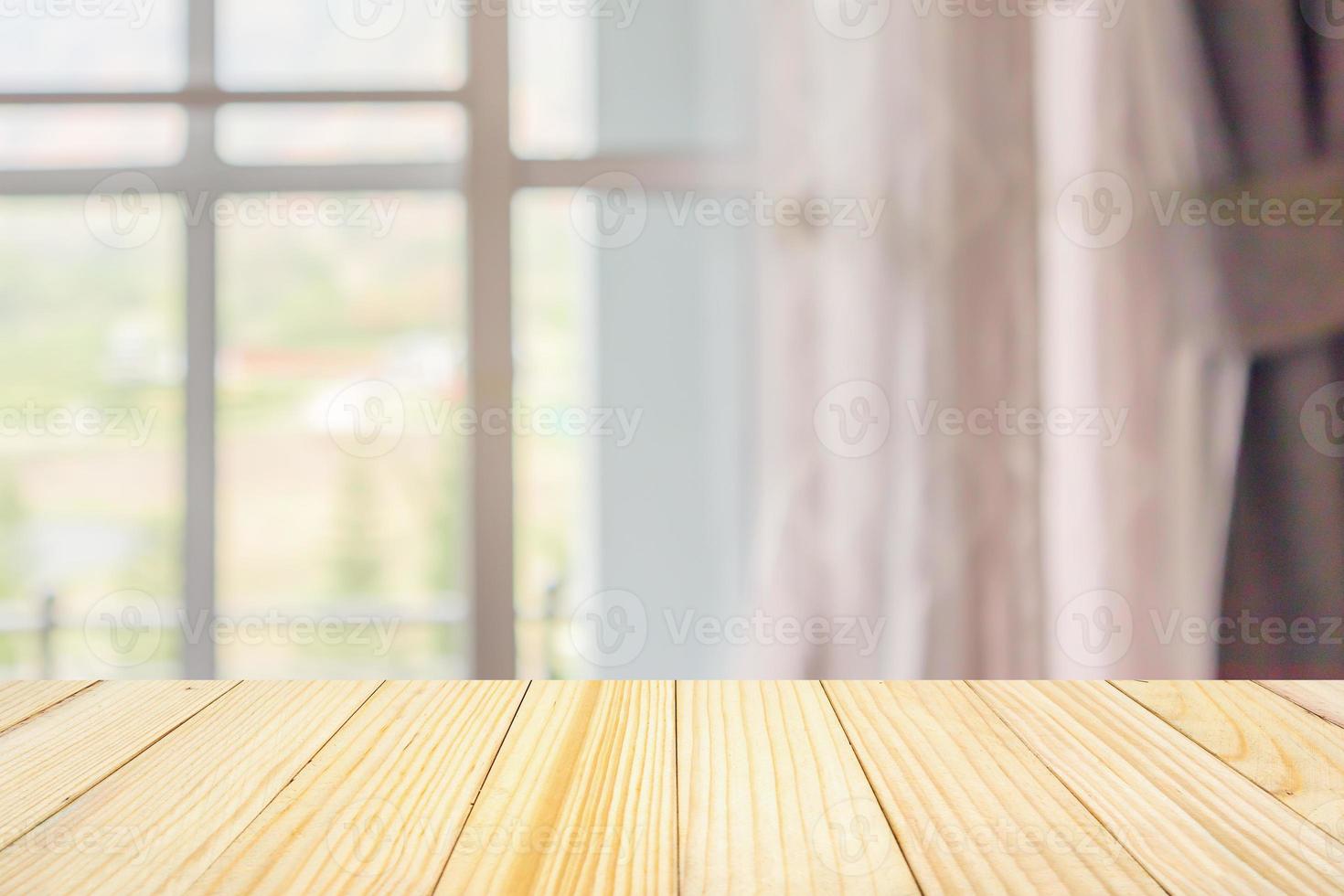 Empty wood table top with window curtain abstract blur background for product display photo