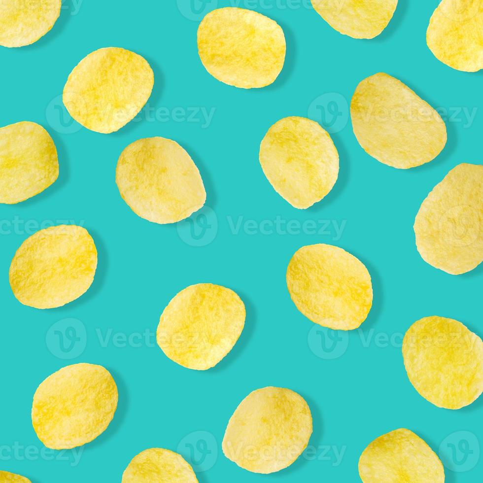 Potato chips pattern on pastel blue background top view flat lay photo