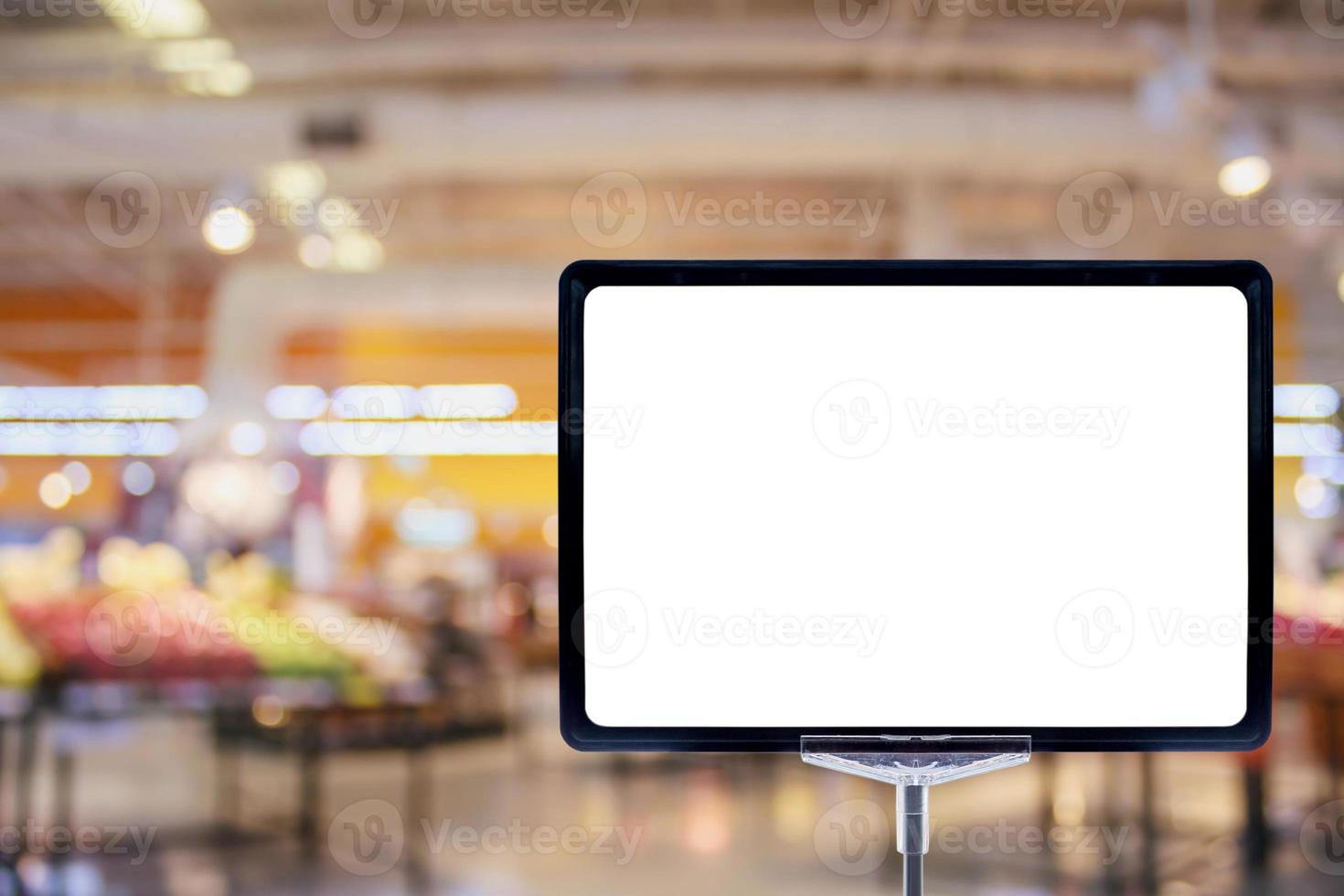 Blank price board sign display in Supermarket with fresh food abstract blurred background with bokeh light photo