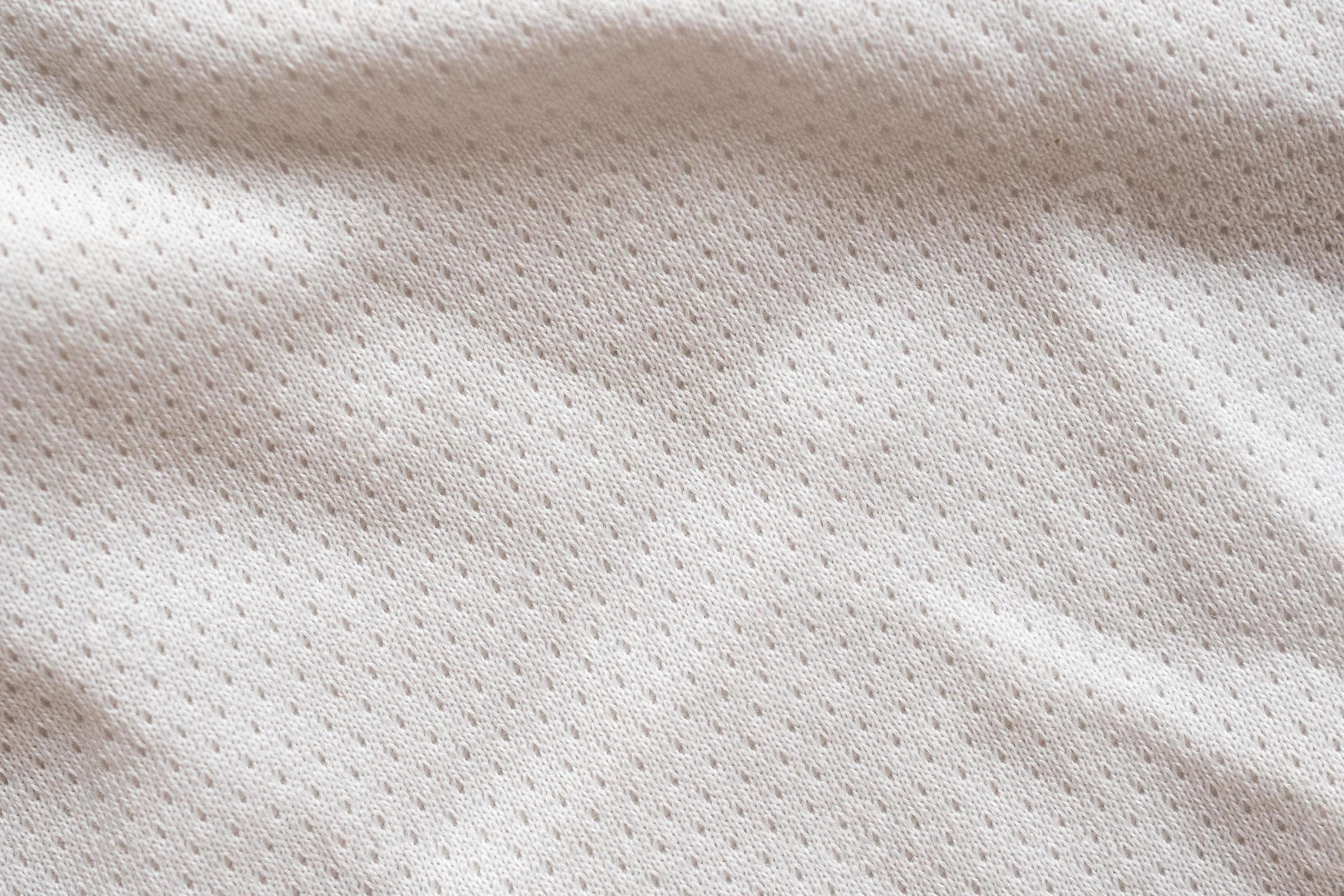 White fabric sport clothing football jersey with air mesh texture ...