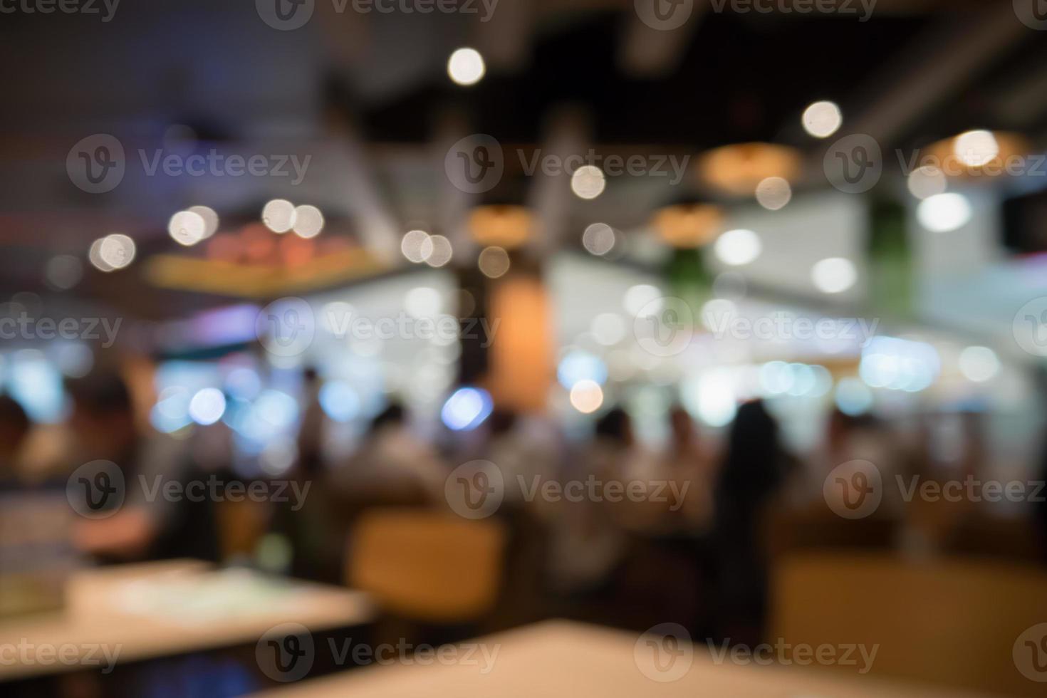 People in restaurant cafe interior with bokeh light blurred customer abstract background photo
