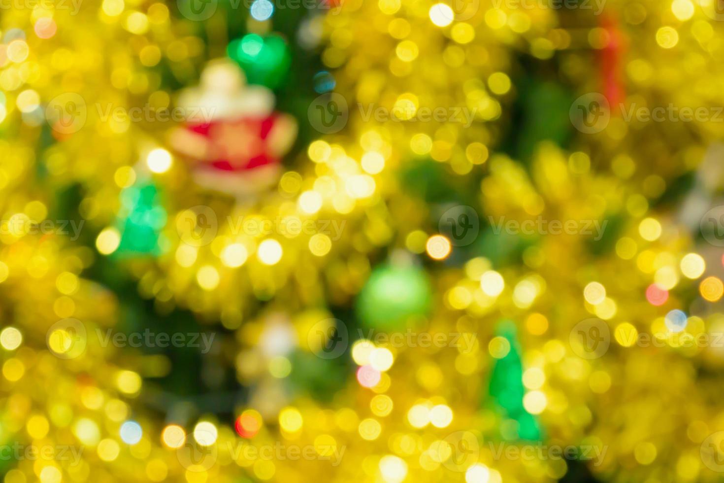 Christmas tree decorated with lights abstract blur background with bokeh photo