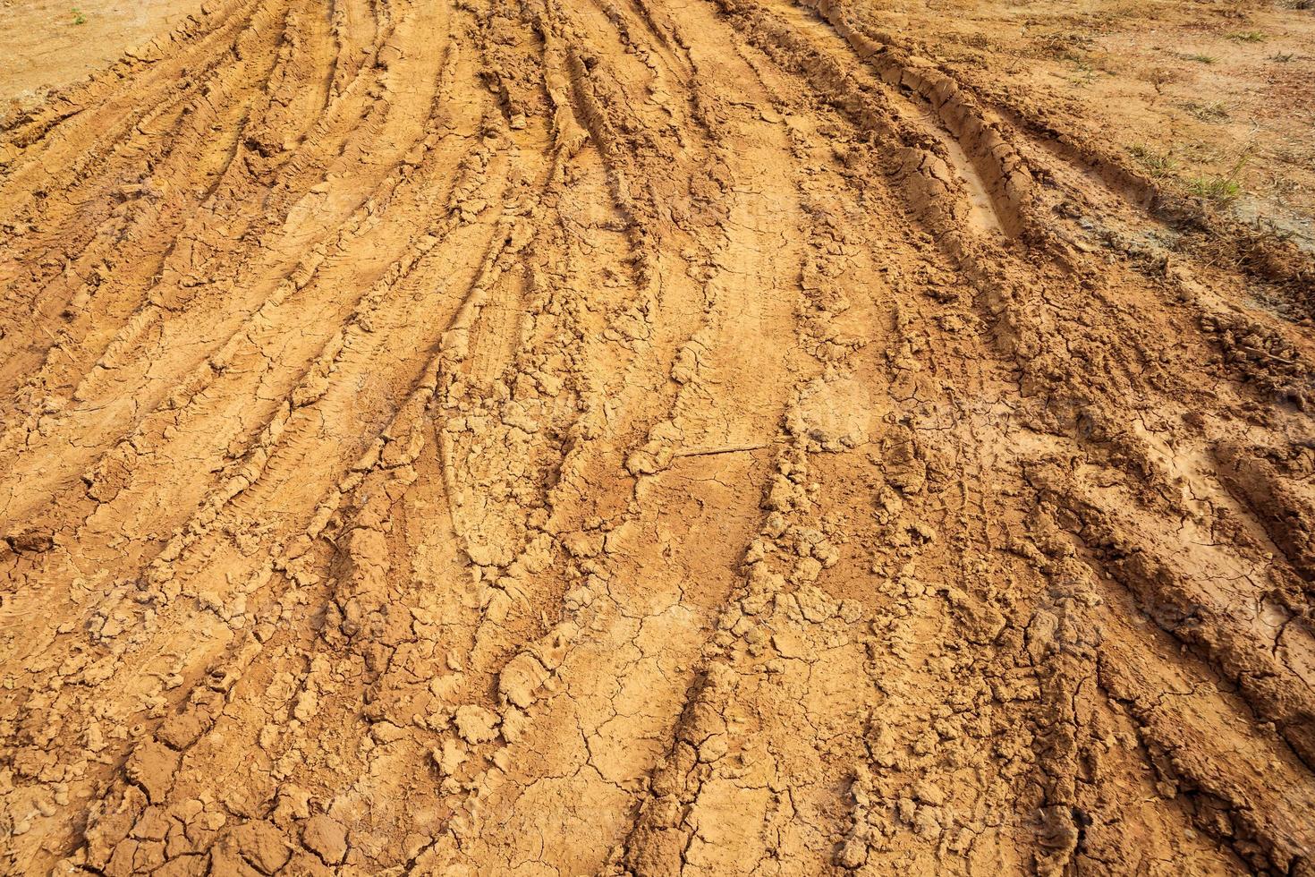 wheel tracks on rural dirt road photo