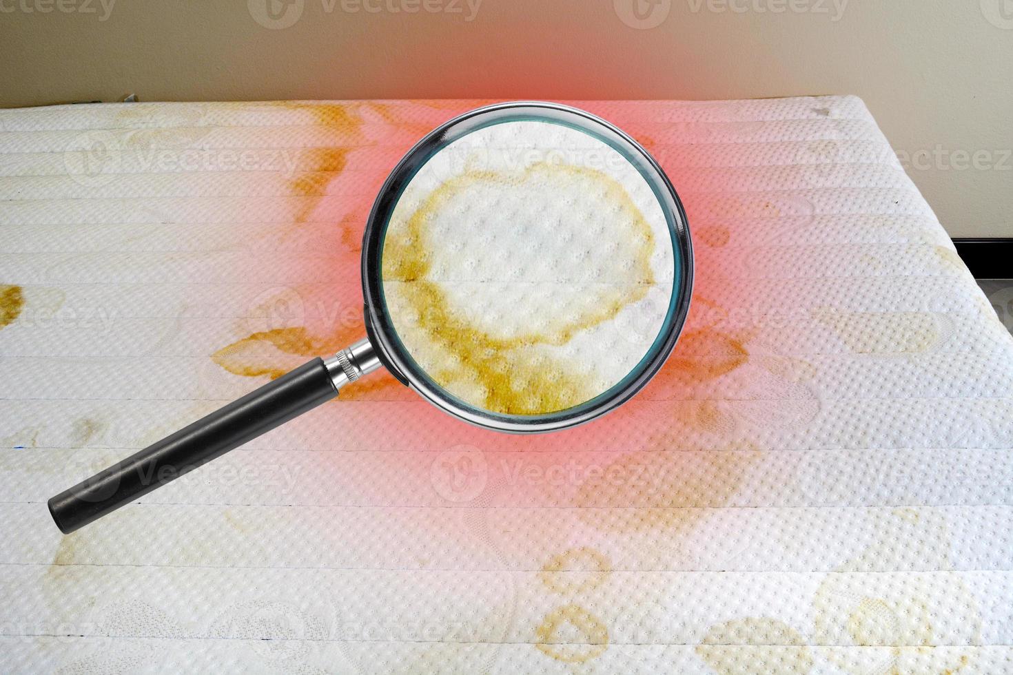 A magnifying glass picture of a child's urine stains on a white