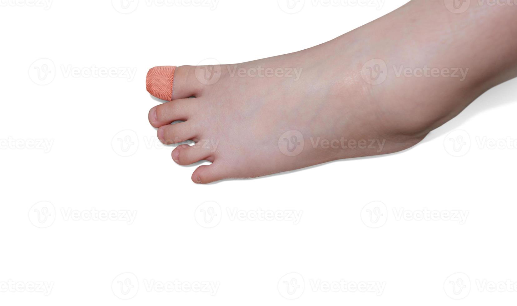 Wounded boy toe with bandage, wound healing, isolated on white concept of pain photo