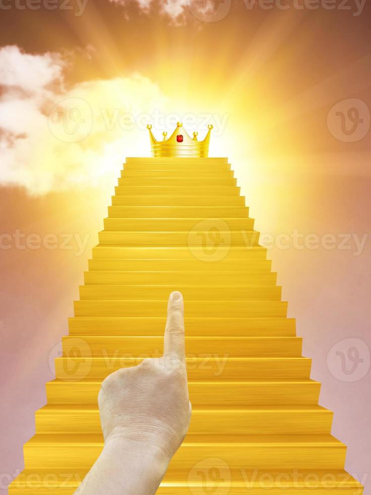 A man's hand is pointing up a golden staircase with a golden crown on top. Most Successful Business Ideas photo