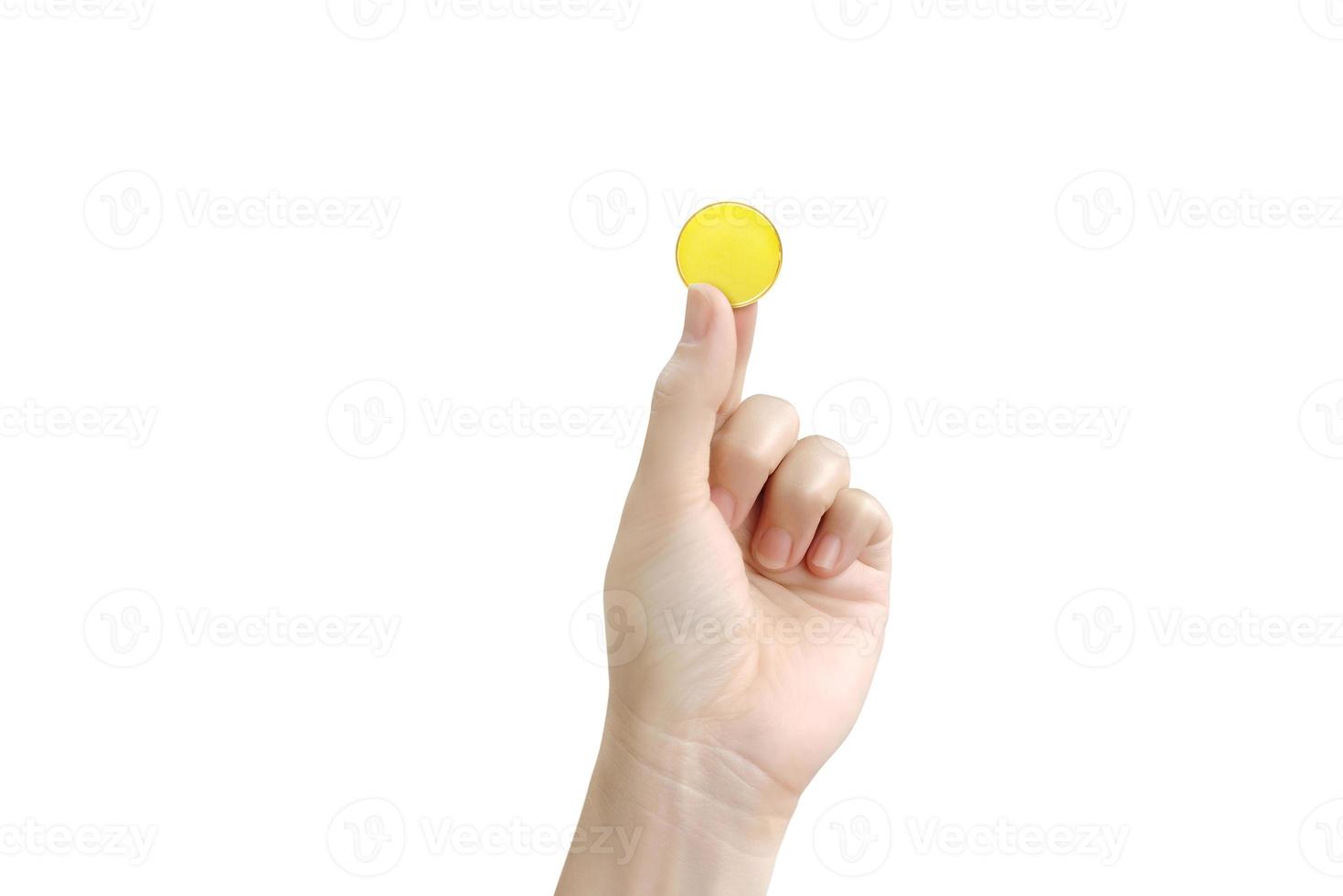 gold coin holding gold coin in male hand isolated on white photo