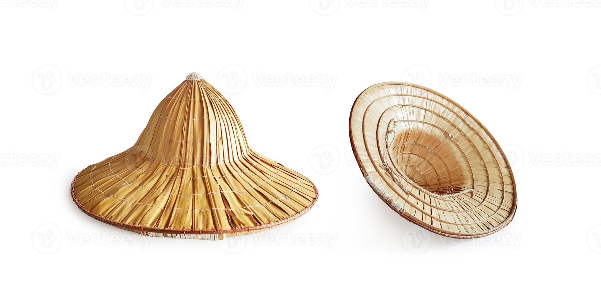 Traditional Asian hat woven with palm leaves. on a white background photo