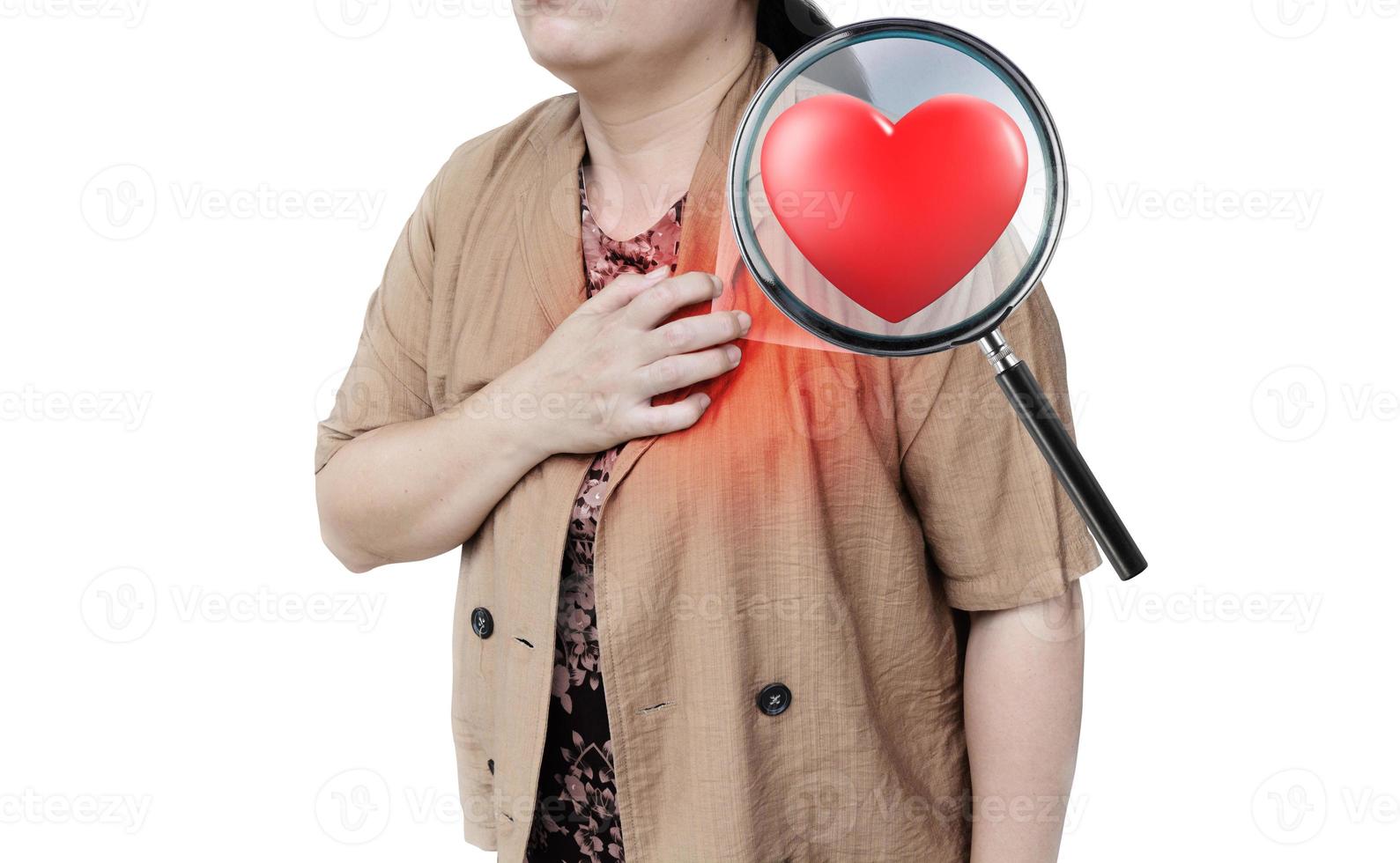Heart-shaped magnifying glass of a woman holding her hand on her chest is having a heart attack. isolated on a white background photo
