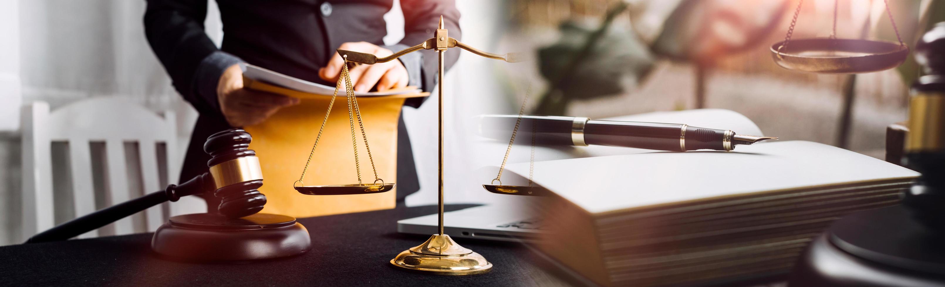 Business and lawyers discussing contract papers with brass scale on desk in office. Law, legal services, advice, justice and law concept picture with film grain effect photo