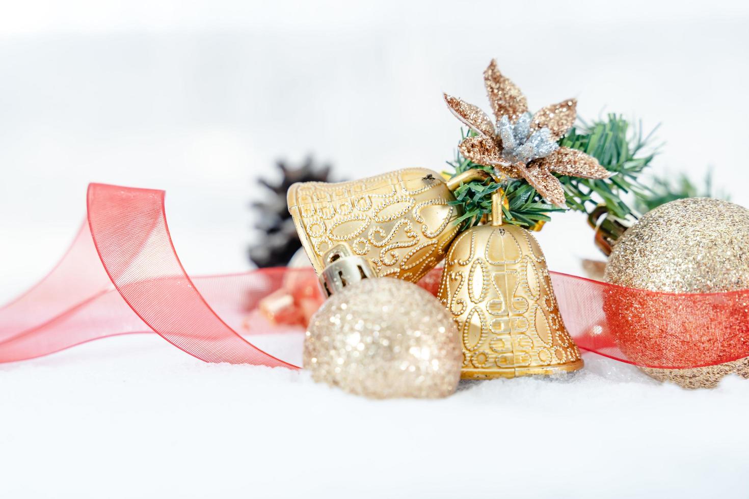 Christmas of  winter - Christmas balls with ribbon on snow, Winter holidays concept. Christmas red balls, golden balls, pine And Snowflakes decorations In Snow Background photo