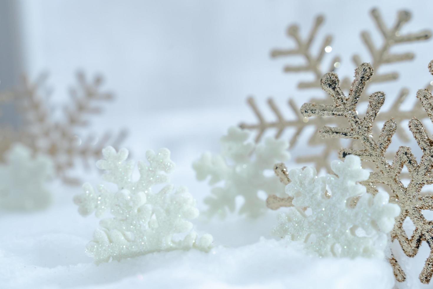 Christmas of  winter - Christmas balls with ribbon on snow, Winter holidays concept. Christmas red balls, golden balls, pine And Snowflakes decorations In Snow Background photo