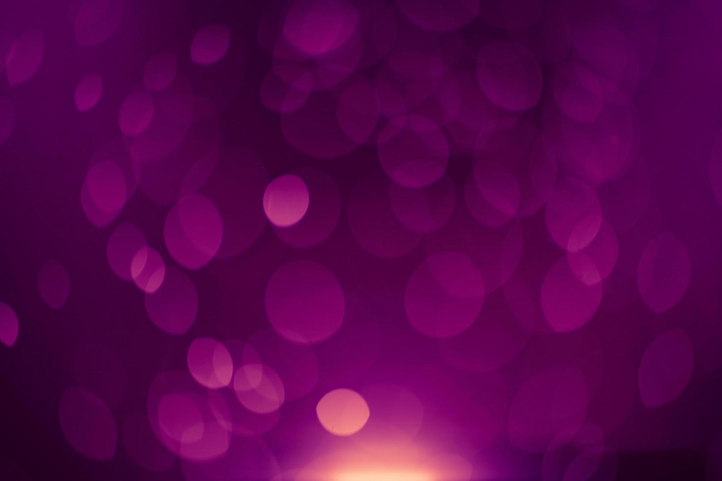 Dark purple Festive Christmas Beautiful abstract Background with bokeh lights. Holiday Texture with copy space. Can be used as Wallpaper, filling for a website, defocused photo