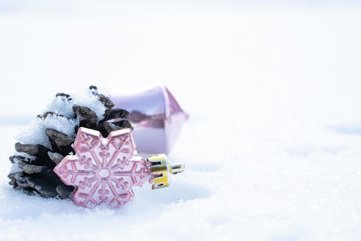 Christmas of  winter - Christmas balls with ribbon on snow, Winter holidays concept. Christmas red balls, golden balls, pine And Snowflakes decorations In Snow Background photo