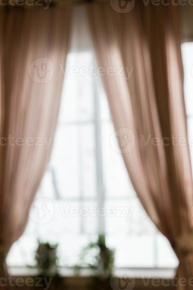 Abstract and blurry image of window with curtains photo