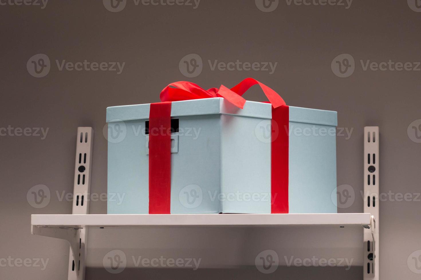 Gift box wrapped in color paper with ribbon bow photo