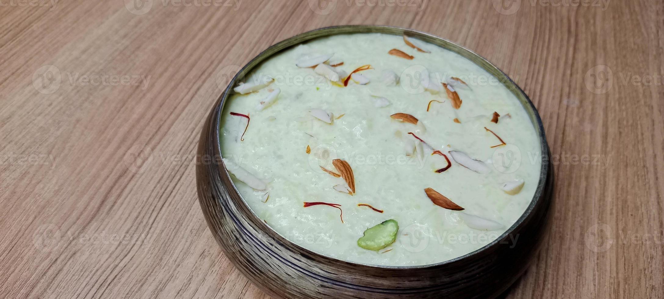 Rice Kheer or Firni or Chawal ki Khir is a pudding from Indian subcontinent, made by boiling milk ,sugar and Rice. Served in a bowl photo