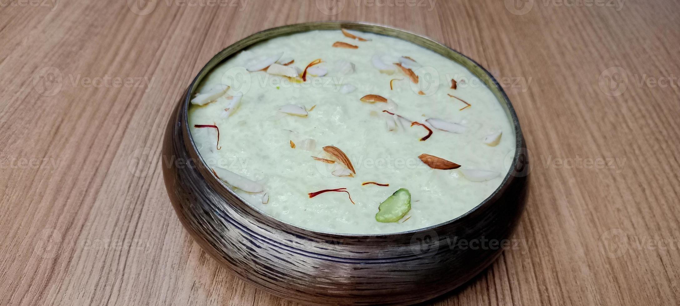 Rice Kheer or Firni or Chawal ki Khir is a pudding from Indian subcontinent, made by boiling milk ,sugar and Rice. Served in a bowl photo