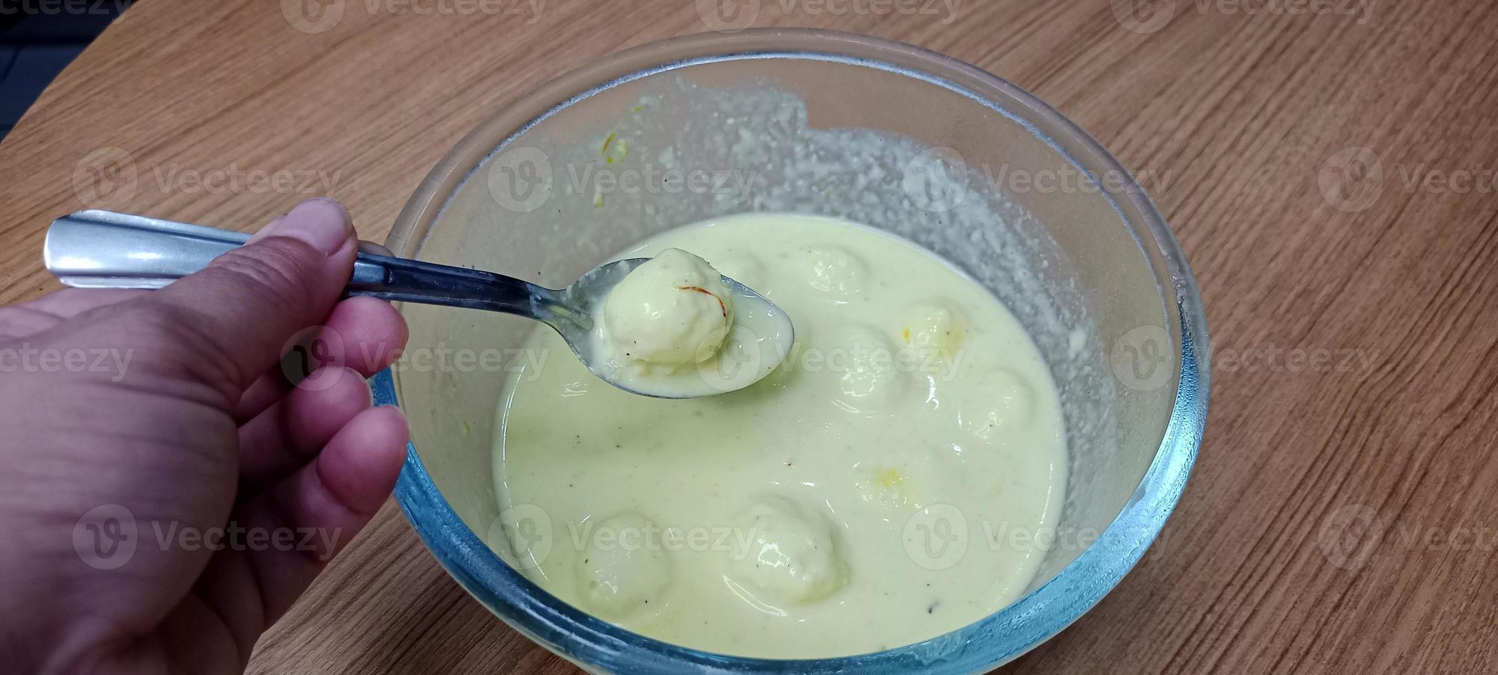 Rasmalai, Rossomalai, Roshmolai, Rasamalei is a very popular Indian dessert. It's a Similar dish to Rasgulla. It is a sweet delicacy made with Indian cottage cheese or chenna photo