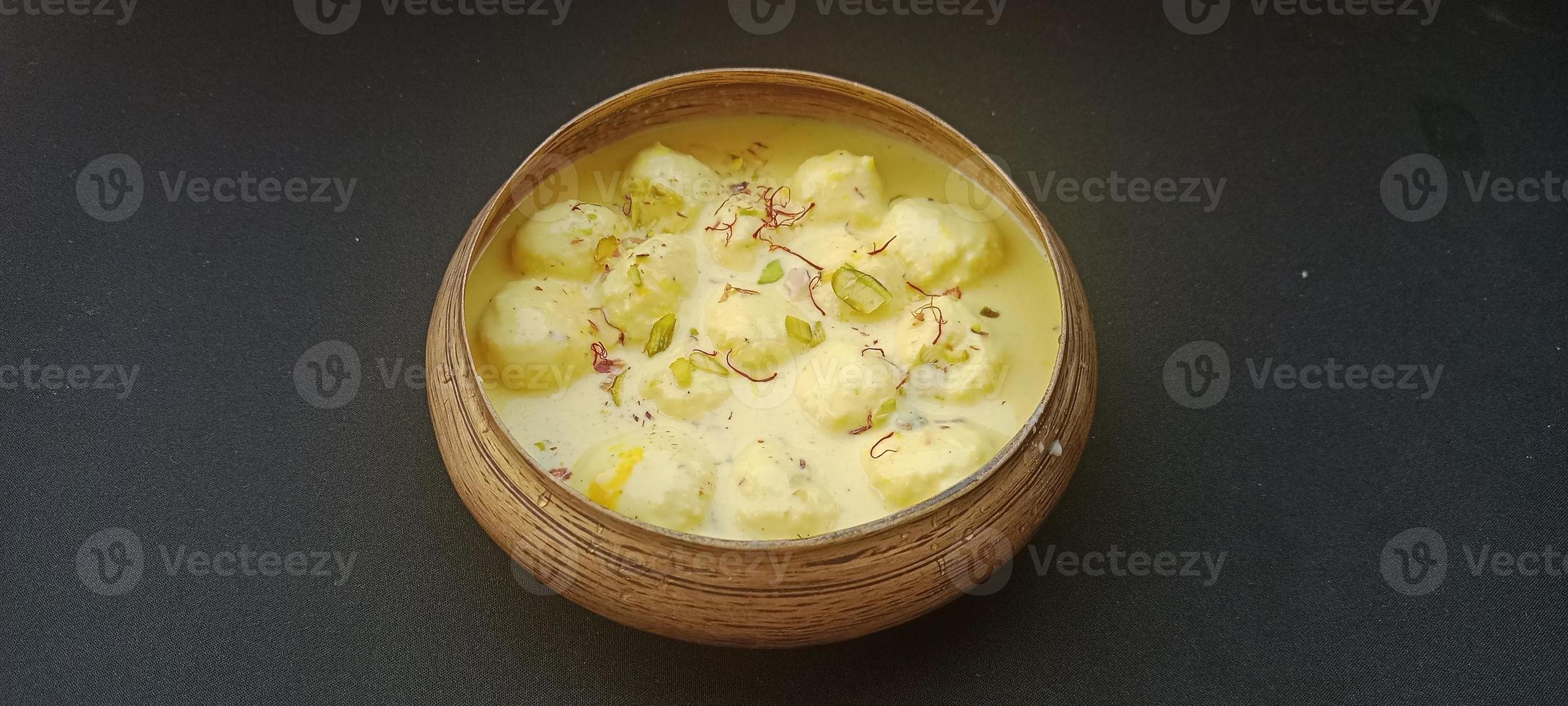 Rasmalai, Rossomalai, Roshmolai, Rasamalei is a very popular Indian dessert. It's a Similar dish to Rasgulla. It is a sweet delicacy made with Indian cottage cheese or chenna photo