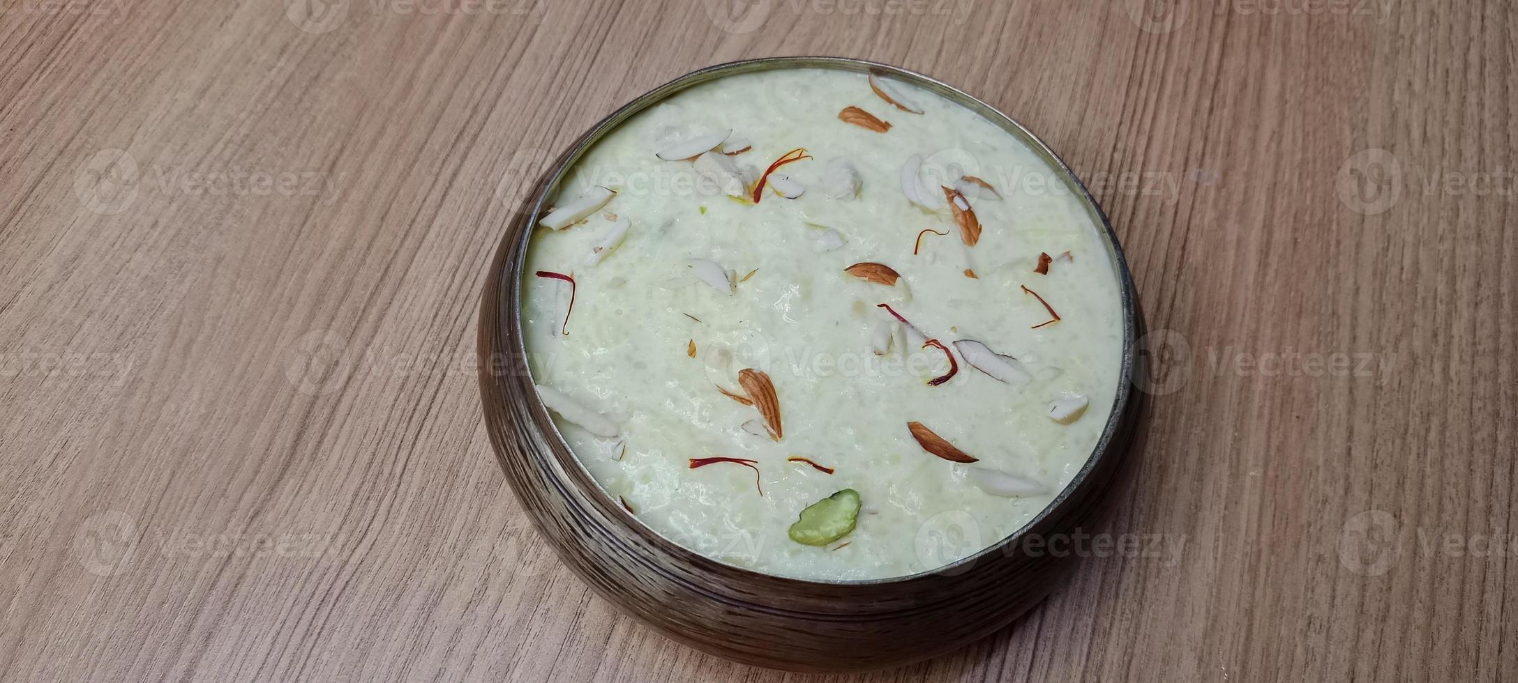 Rice Kheer or Firni or Chawal ki Khir is a pudding from Indian subcontinent, made by boiling milk ,sugar and Rice. Served in a bowl photo