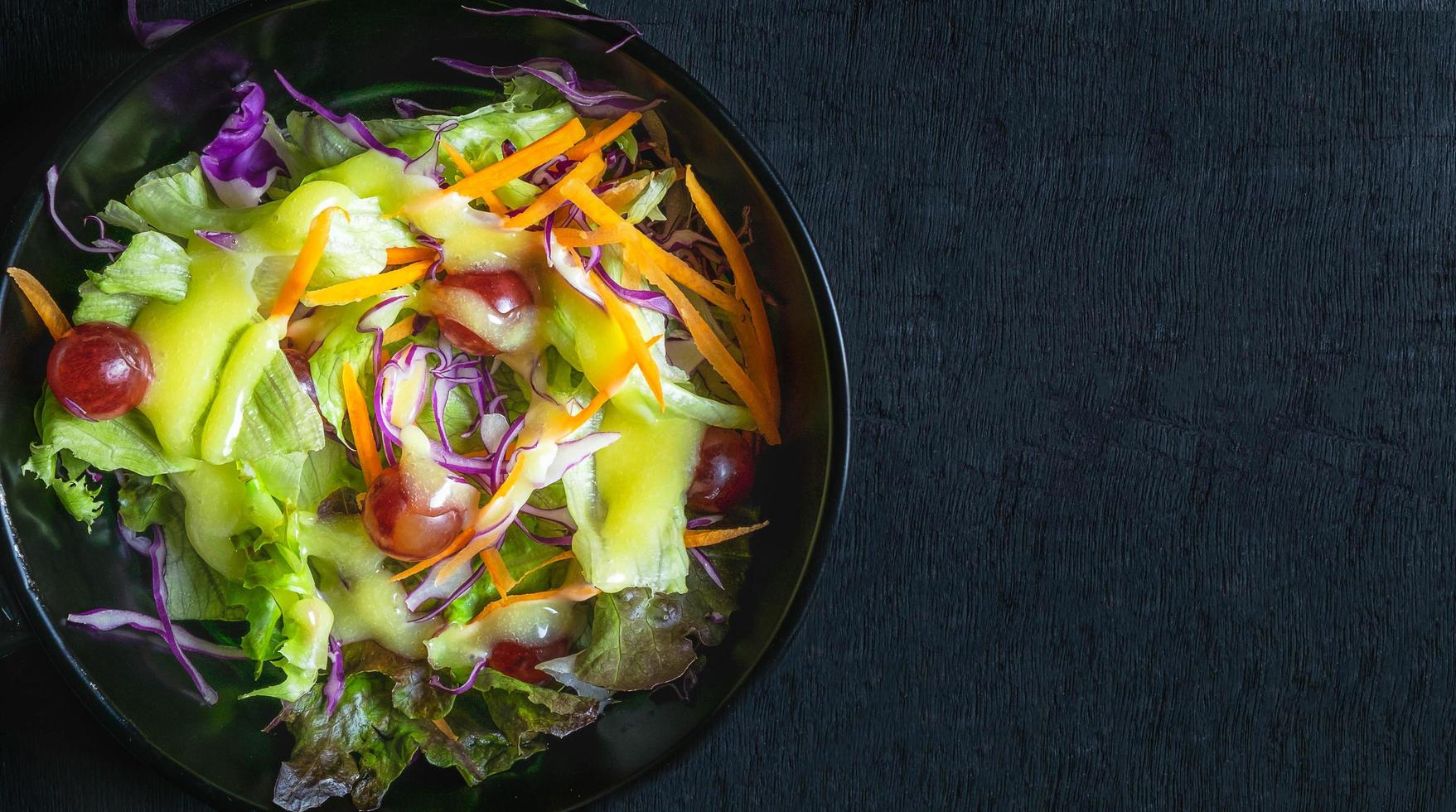 Top view of homemade menu healthy vegetable salad of fresh tomato, Topped with salad dressing cooking on plate photo