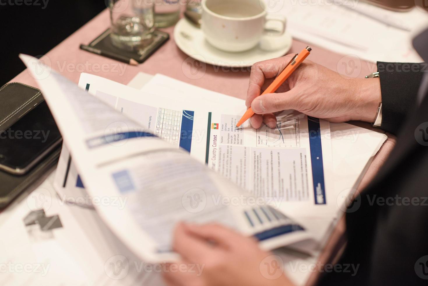 Close-up of woman hand making notes photo