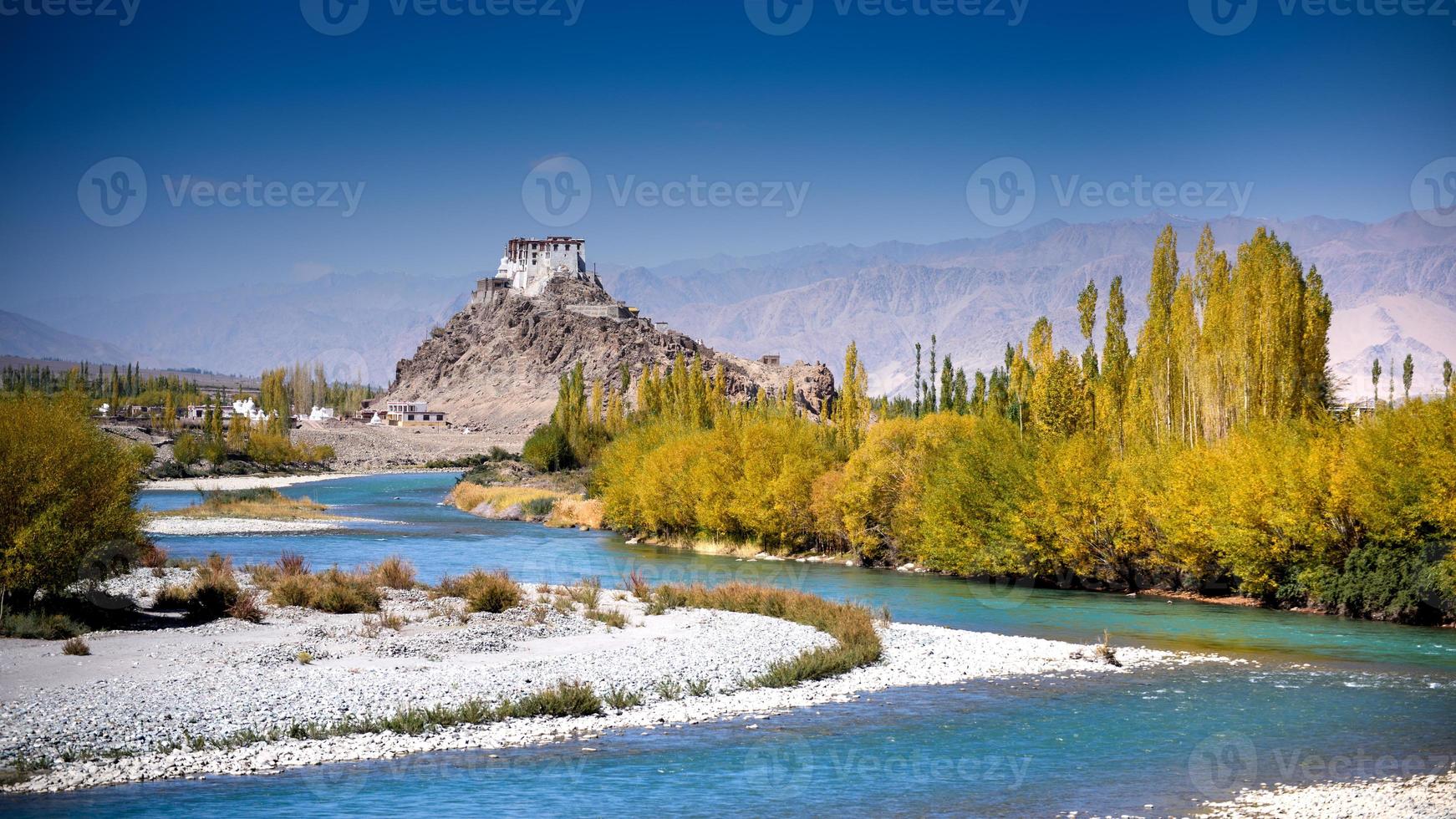 Stakna monastery with view of Himalayan mountians photo
