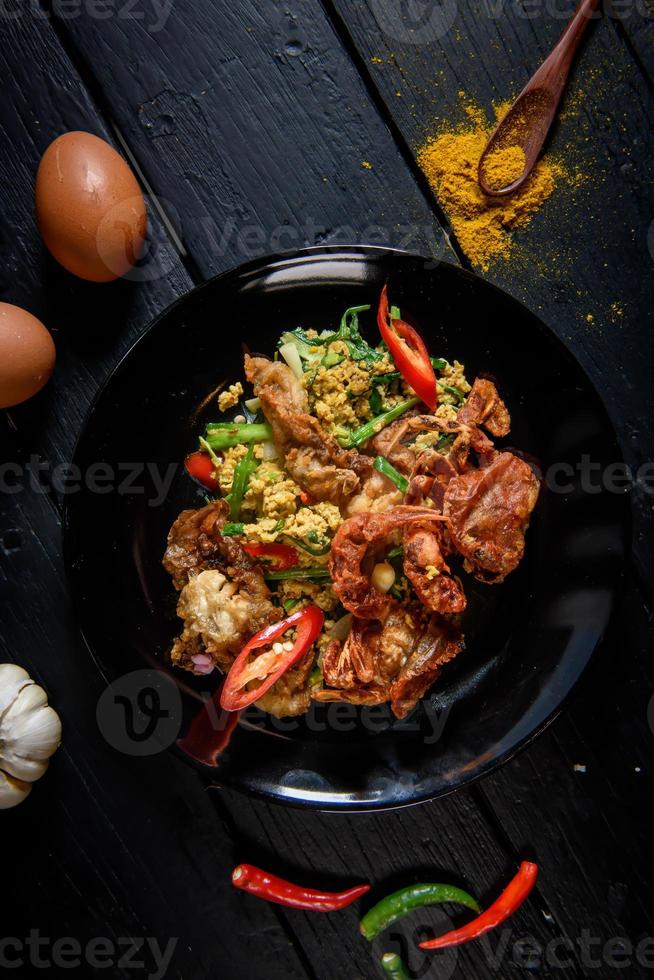 Stir Fried Soft Shell Crab Curry Powder with Sweet Chili and Egg It is a famous seafood in Thailand. photo