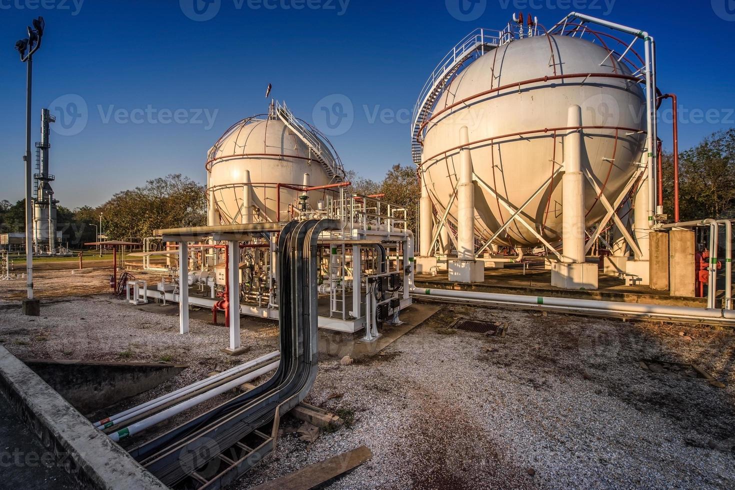 white propane tank with a fuel gas pipeline in the morning. photo