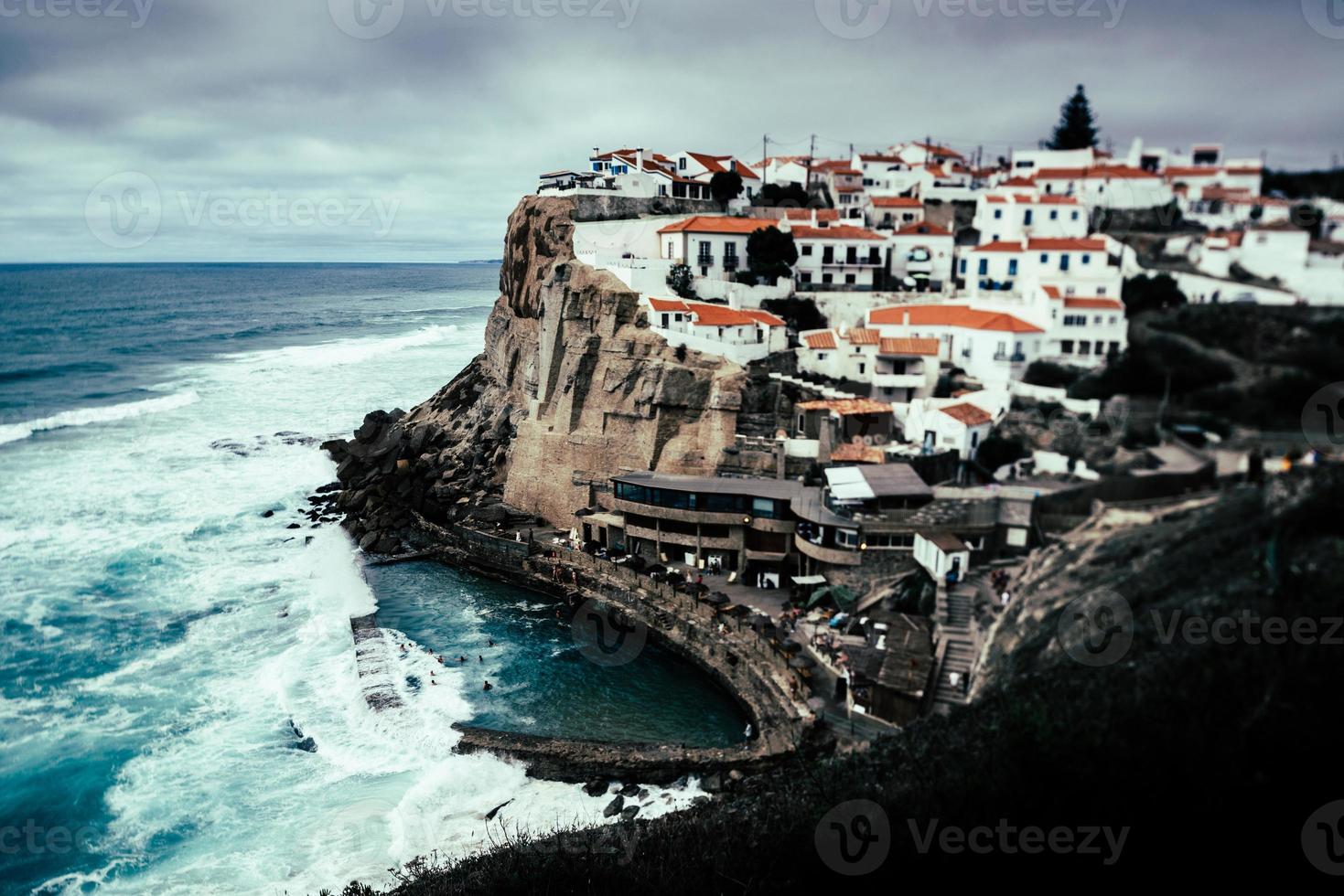 View to Azenhas do Mar rocky beach and village in Colares, Portugal. Tilt-shift effect photo