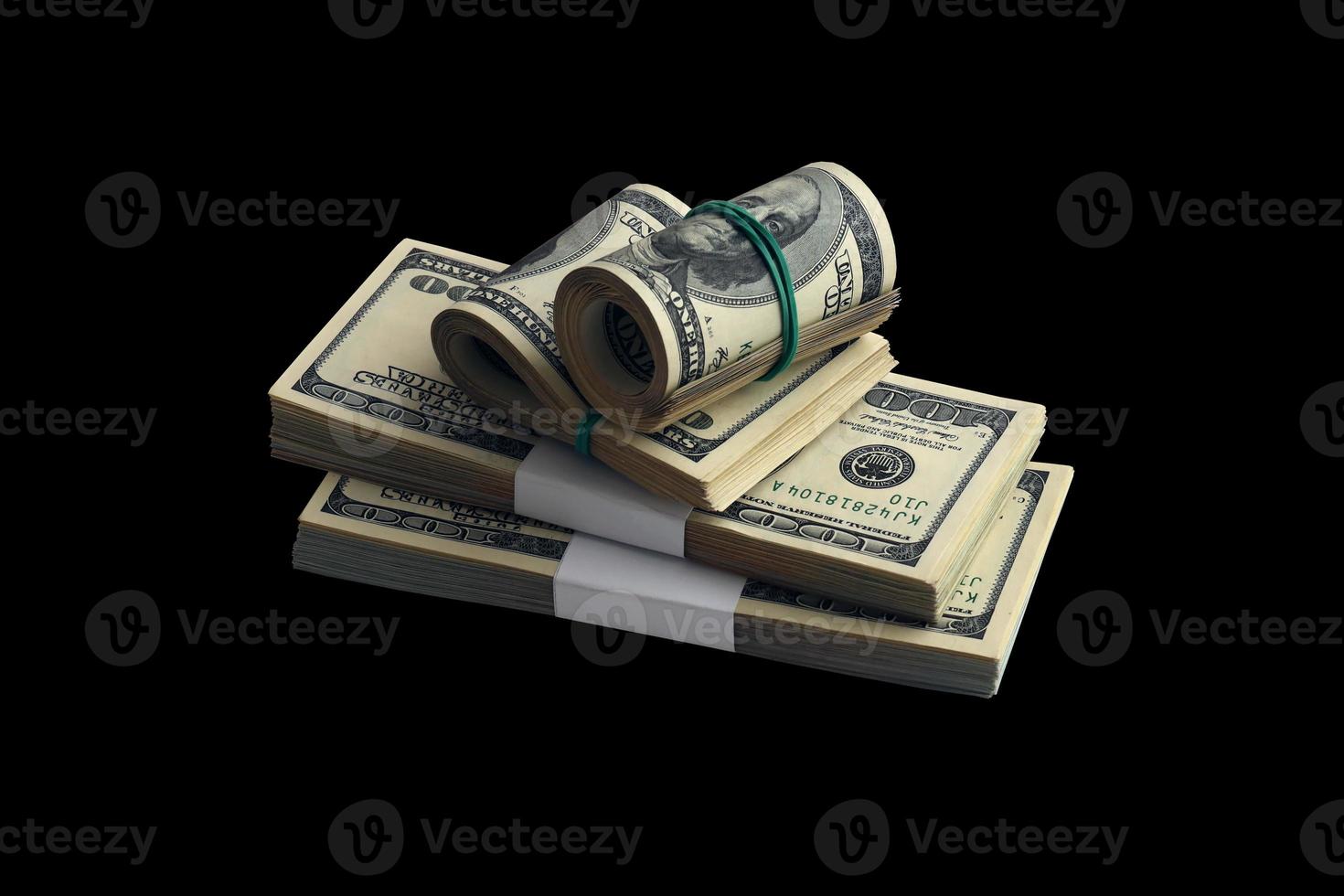 Bundle of US dollar bills isolated on black. Pack of american money with high resolution on perfect black background photo