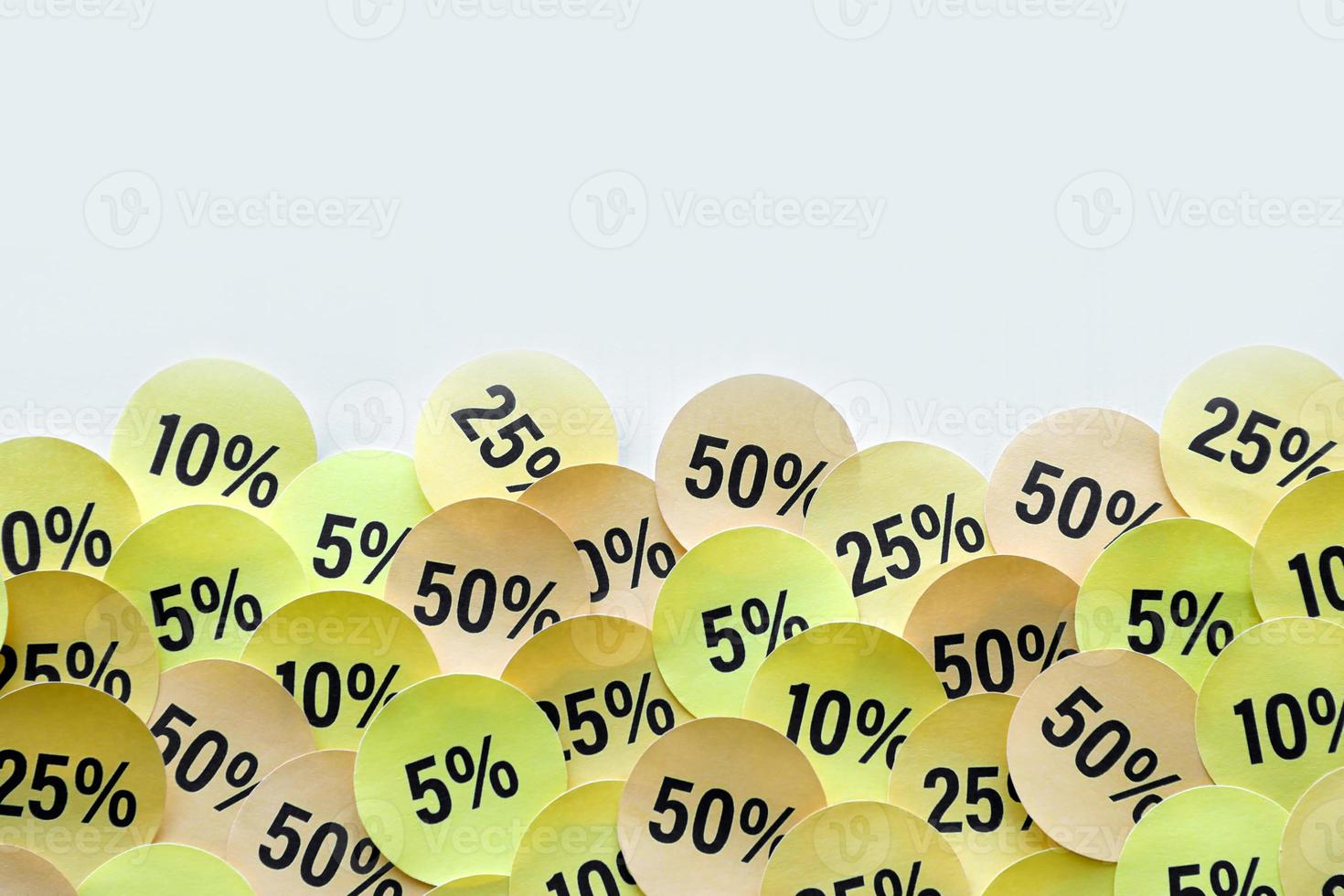 Large amount of stickers with yellow percentage values for black friday or cyber monday sale. Abstract image of discount prices photo