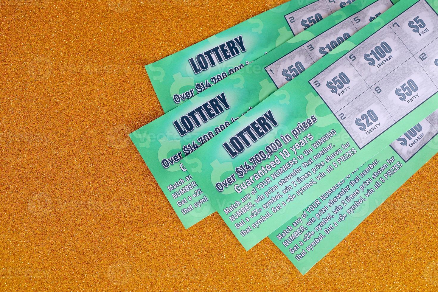 Close up view of green lottery scratch cards. Many used fake instant lottery tickets with gambling results. Gambling addiction photo