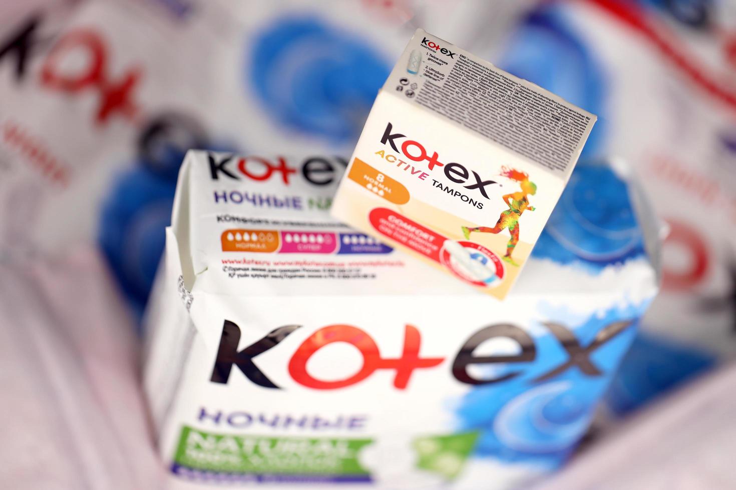 KHARKIV, UKRAINE - DECEMBER 16, 2021 Kotex production with logo. Kotex is a brand of feminine hygiene products, includes maxi, thin and ultra thin pads. photo