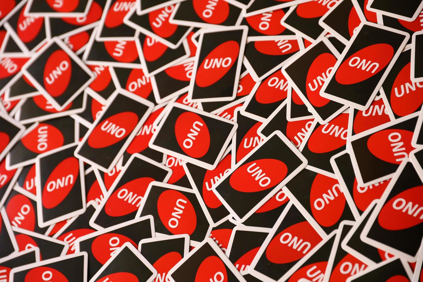 TERNOPIL, UKRAINE - MAY 15, 2022 Many colorful UNO game cards. UNO is an American shedding-type card game that is played with a specially printed deck photo