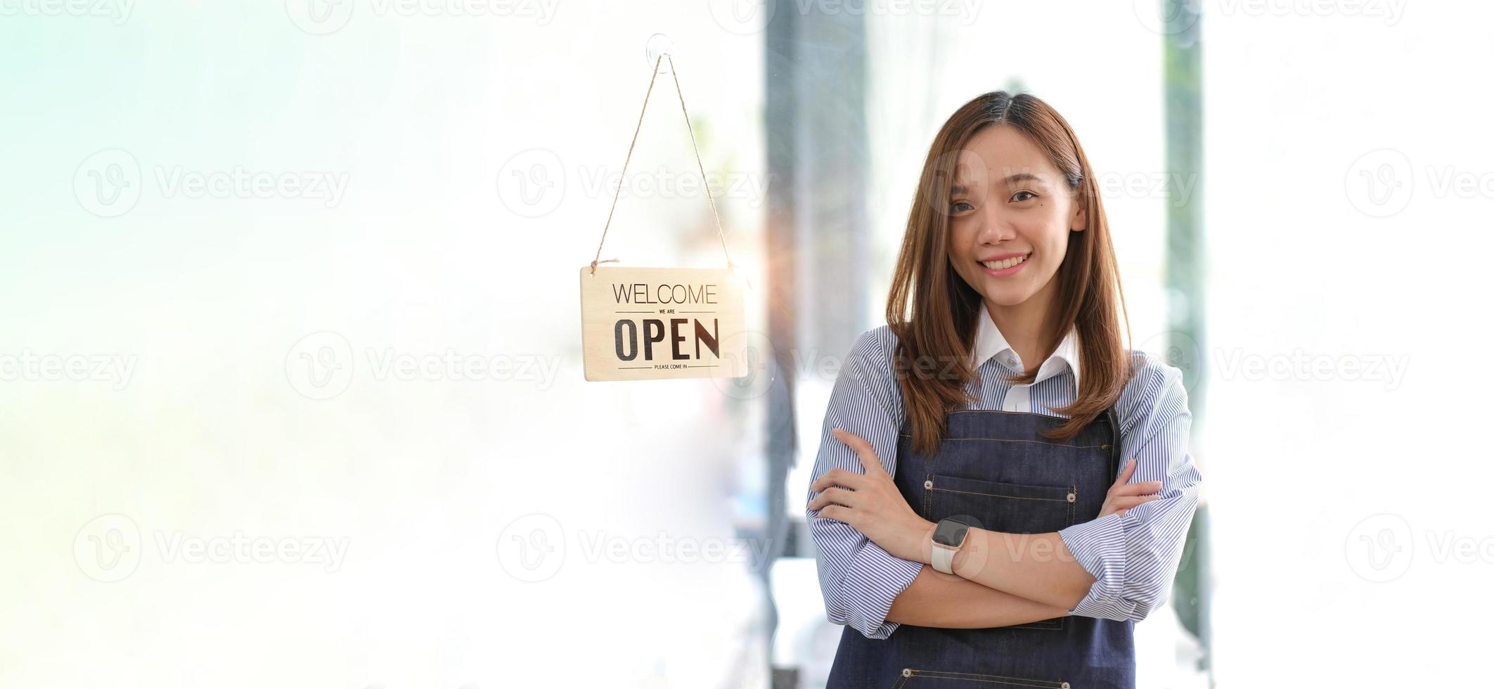 Startup successful small business owner sme beauty girl stand with tablet smartphone in coffee shop restaurant. Portrait of asian tan woman barista cafe owner. SME entrepreneur seller business concept photo