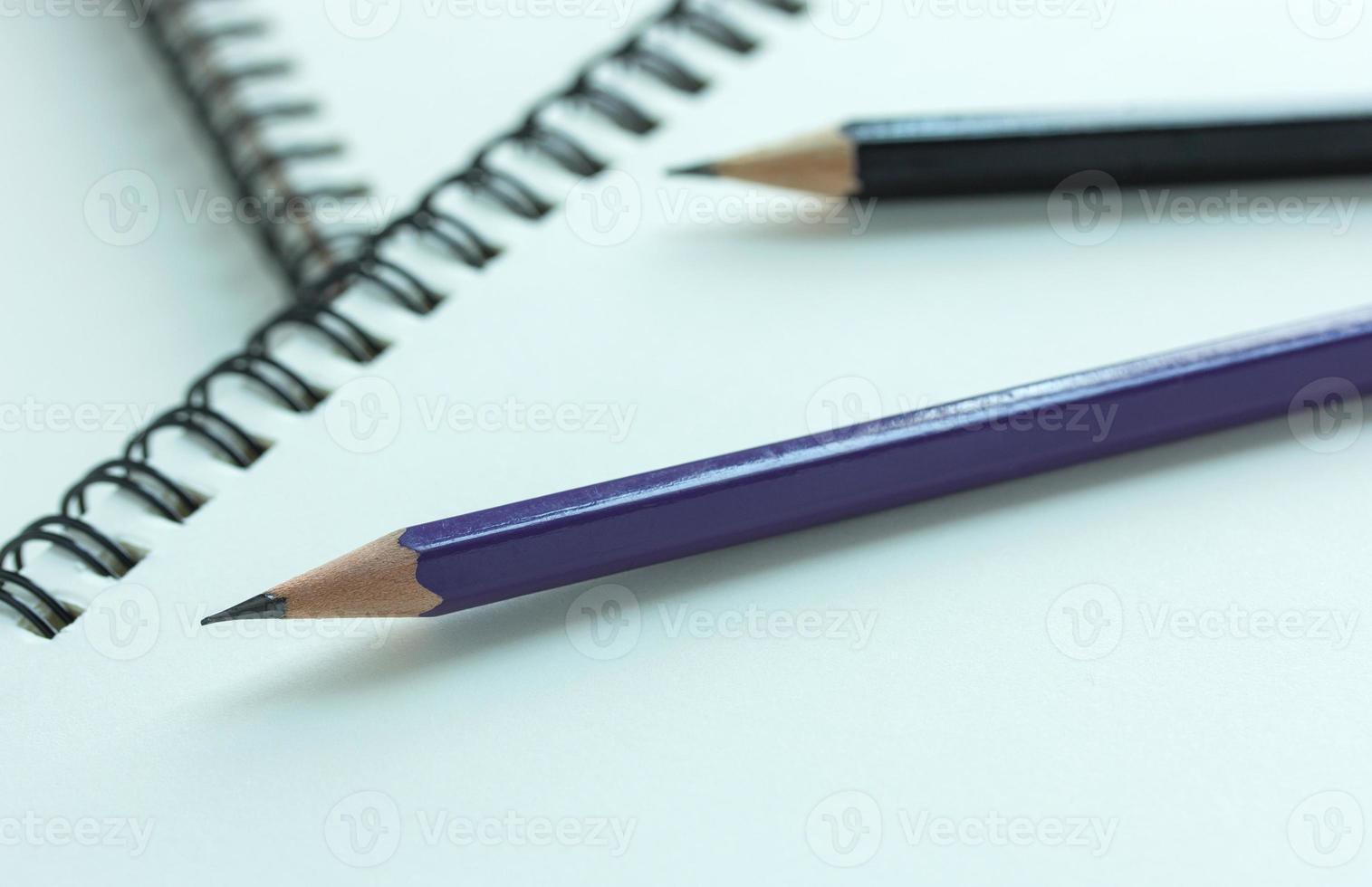 pencil and spiral notebook, selective focus point photo