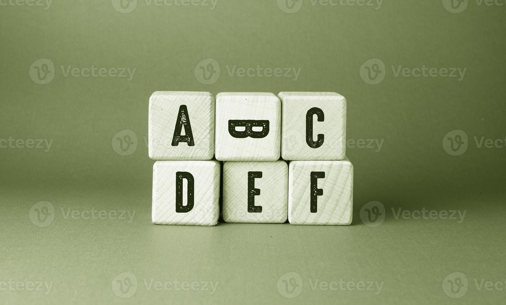 Alphabet English Text Written on Wooden Cubes photo