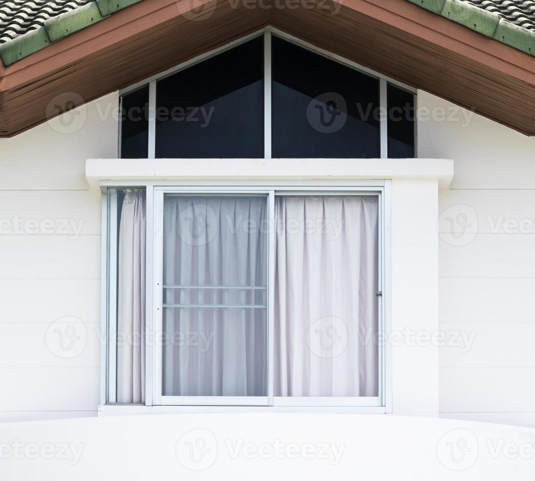 Glass window on modern white house photo