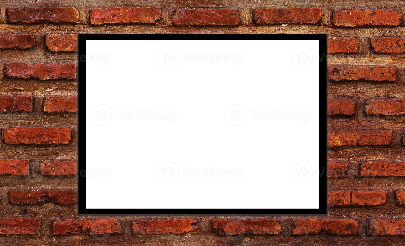 Mockup white picture frame on orange brick wall background with clipping path photo