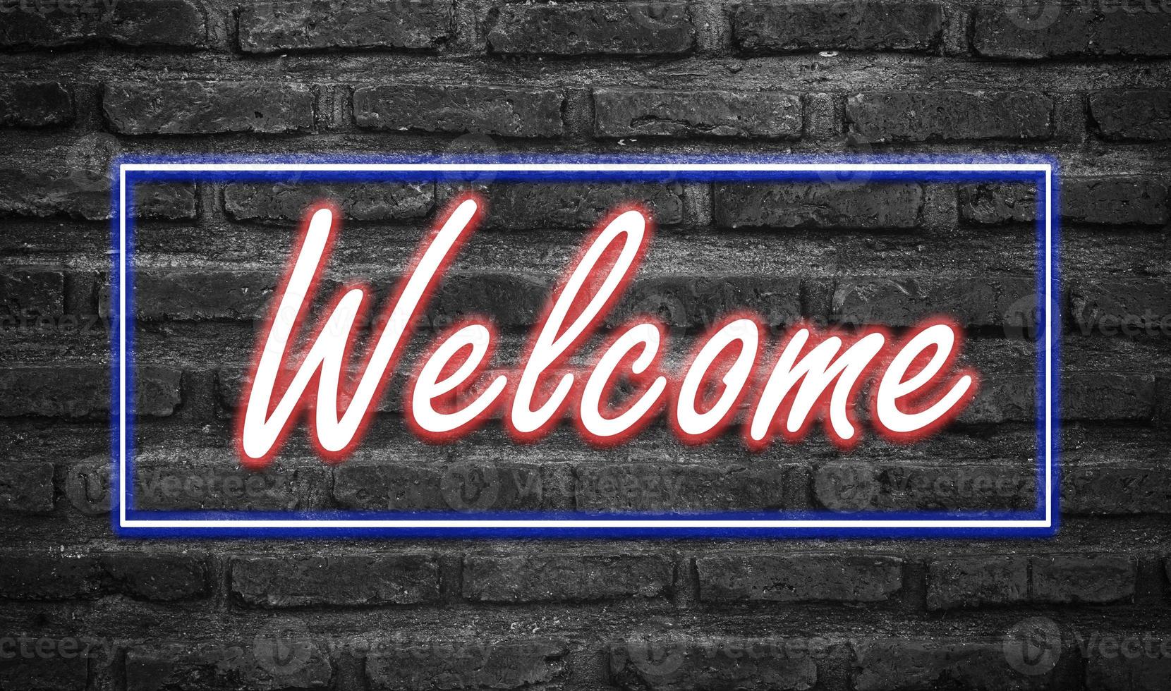 Message Welcome with effect neon light on black brickwall photo