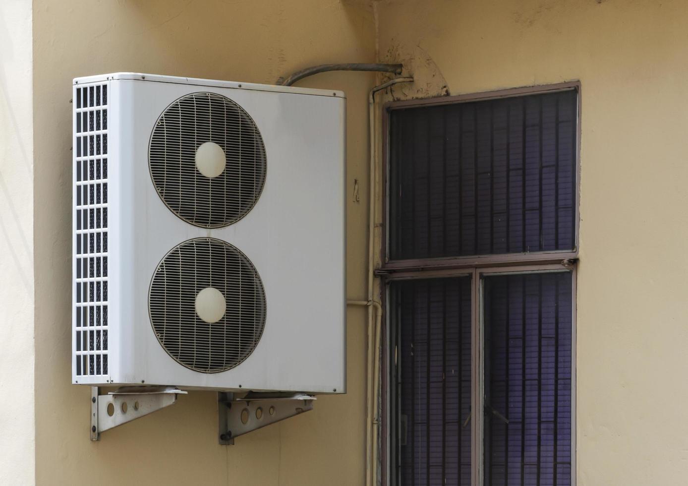 Large air compressor on building photo