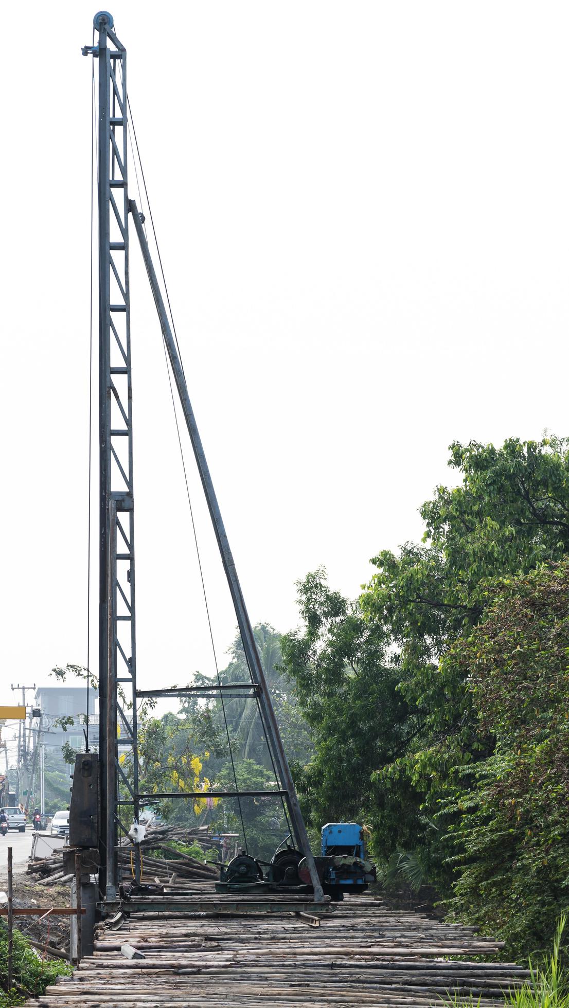 Derrick at road construction site 11840397 Stock Photo at Vecteezy
