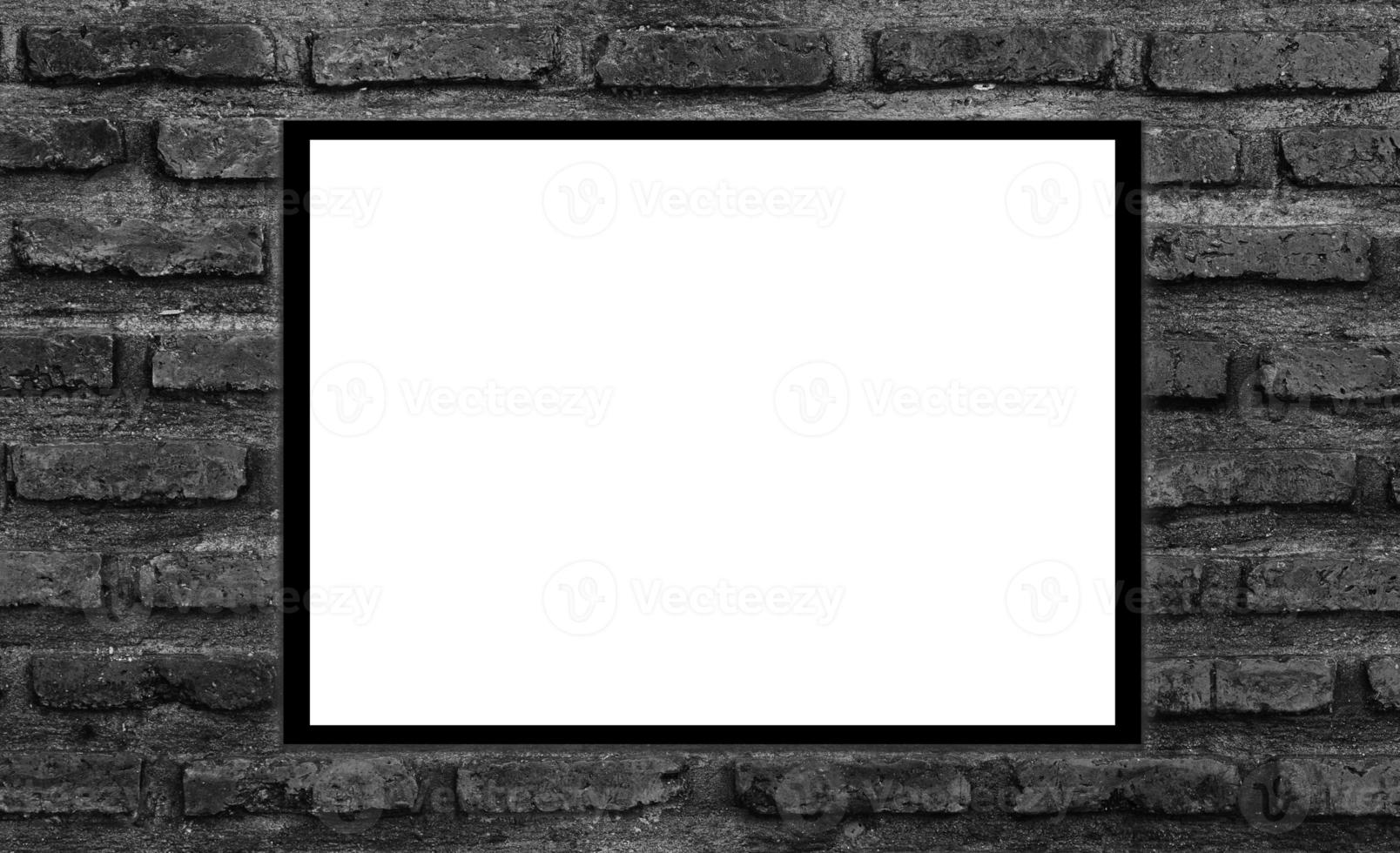 Mockup white picture frame on black brick wall background with clipping path photo