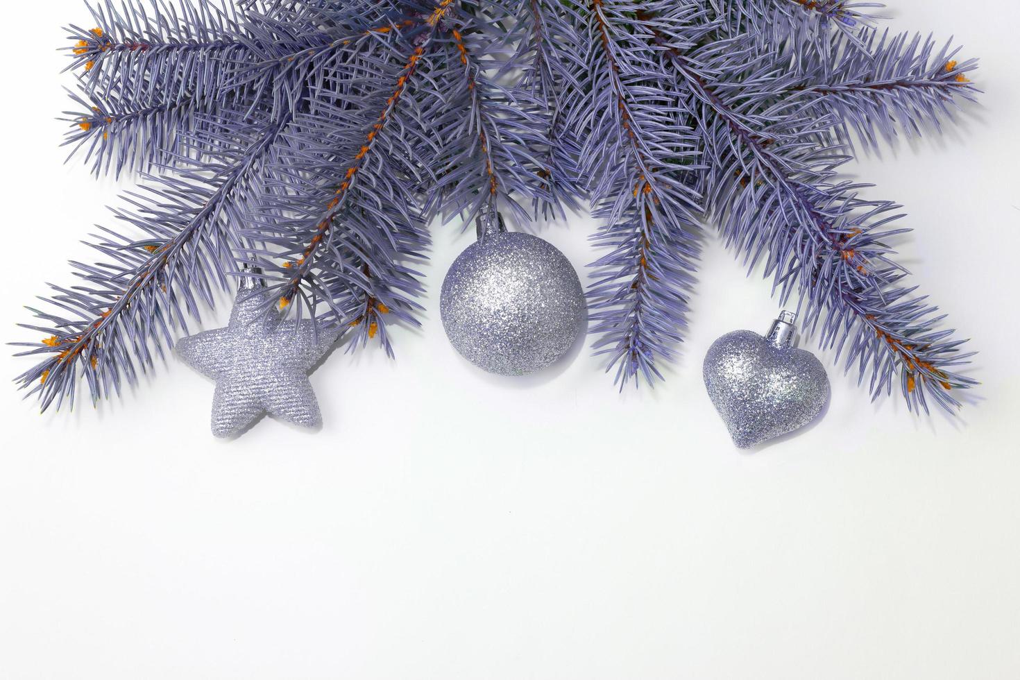 Christmas festive decoration in the form of a Christmas tree with silver toys. Creative holiday design. Cartoon flat illustrations. White background. Christmas frame. color 2022. very peri photo